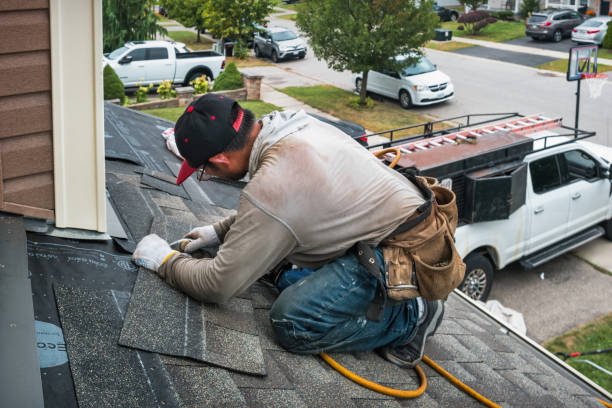 Professional Storm Damage Roof Repair technician working in Booneville, MS